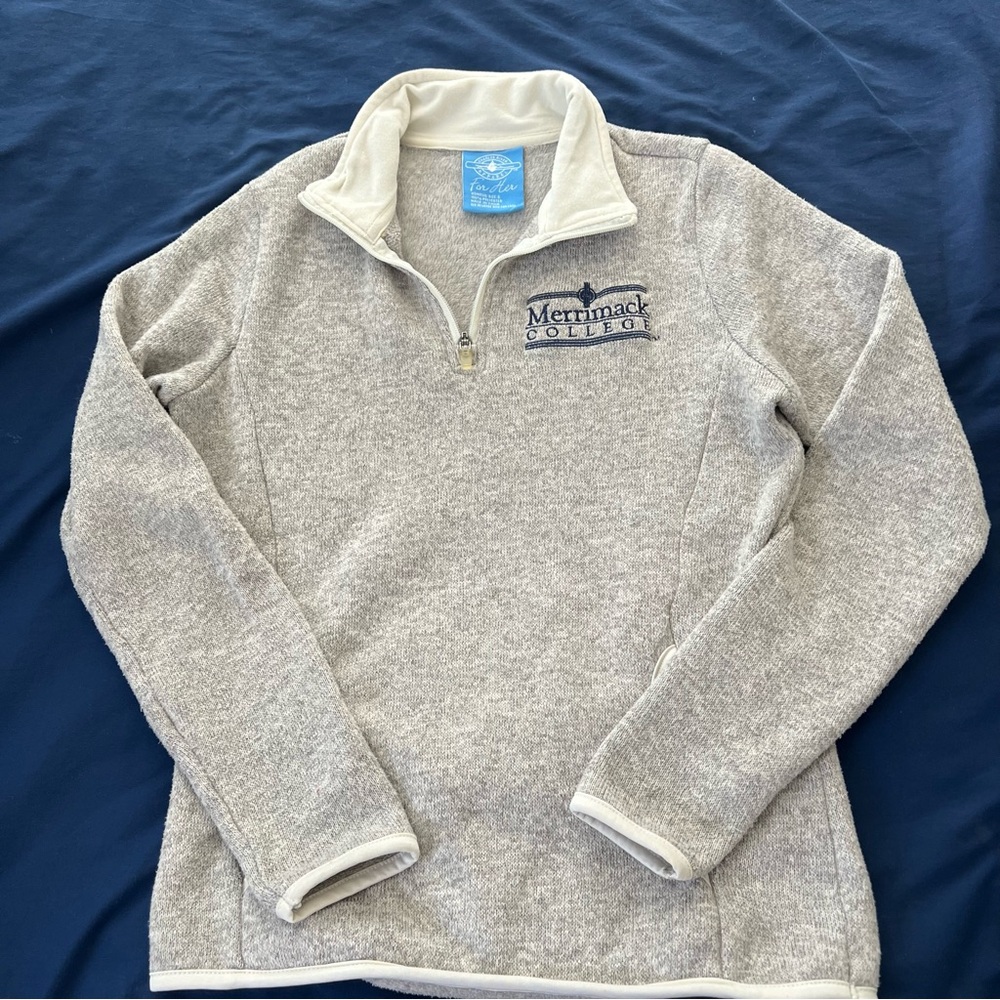 Merrimack College quarter zip women’s sweater with embroidered logo.